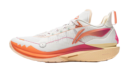 White basketball shoe with orange trim, mesh upper, and beige outsole