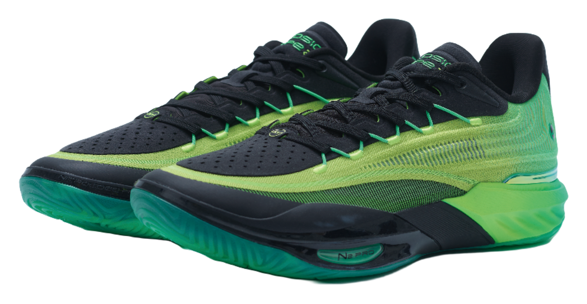 Green and black low-top basketball shoes with green laces and turquoise sole edge