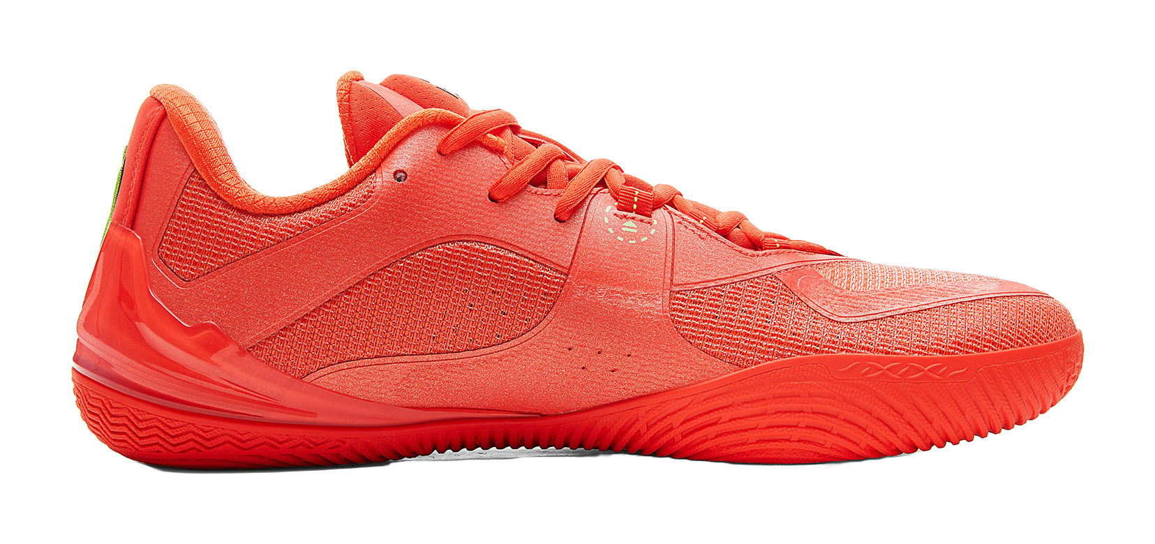 Orange-red low-top basketball shoe, lace-up vamp and textured upper, angled side view.