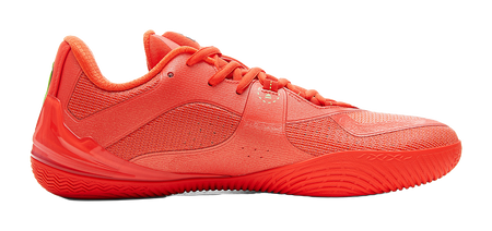 Orange-red low-top basketball shoe, lace-up vamp and textured upper, angled side view.