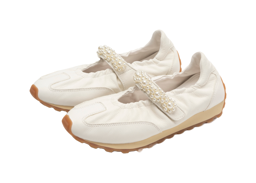 Pair of women's white Mary Jane shoes with pearl strap and toe stitching