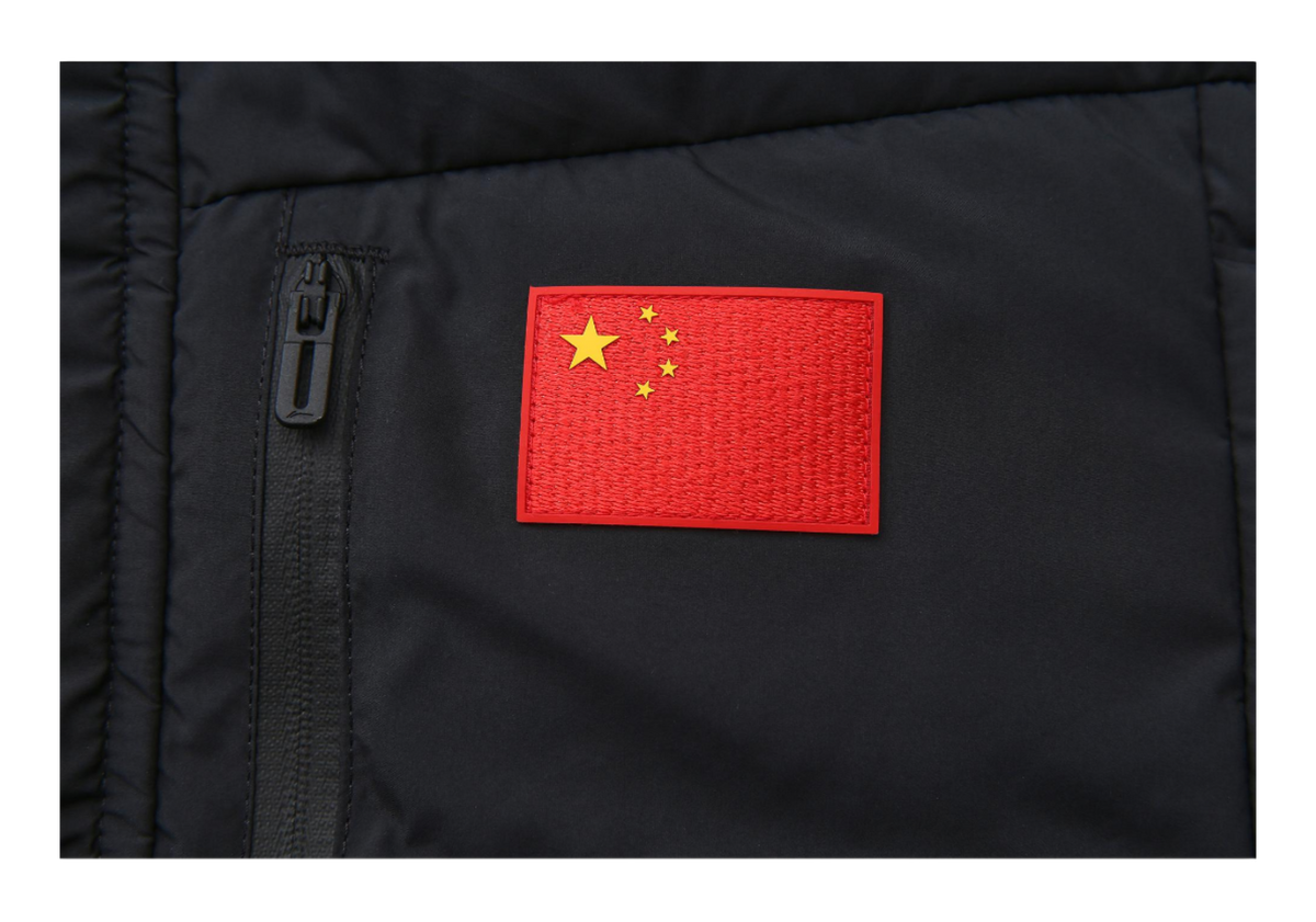Black down jacket close-up with red China flag patch and zipper pull