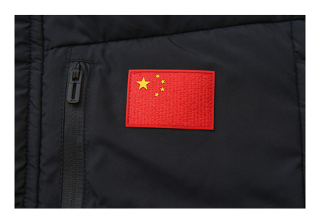 Black down jacket close-up with red China flag patch and zipper pull