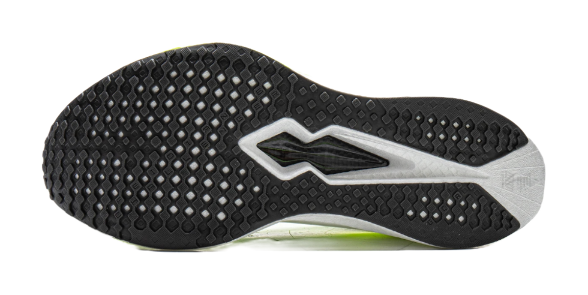 Black rubber tread outsole with gray edges and fluorescent green midfoot accent