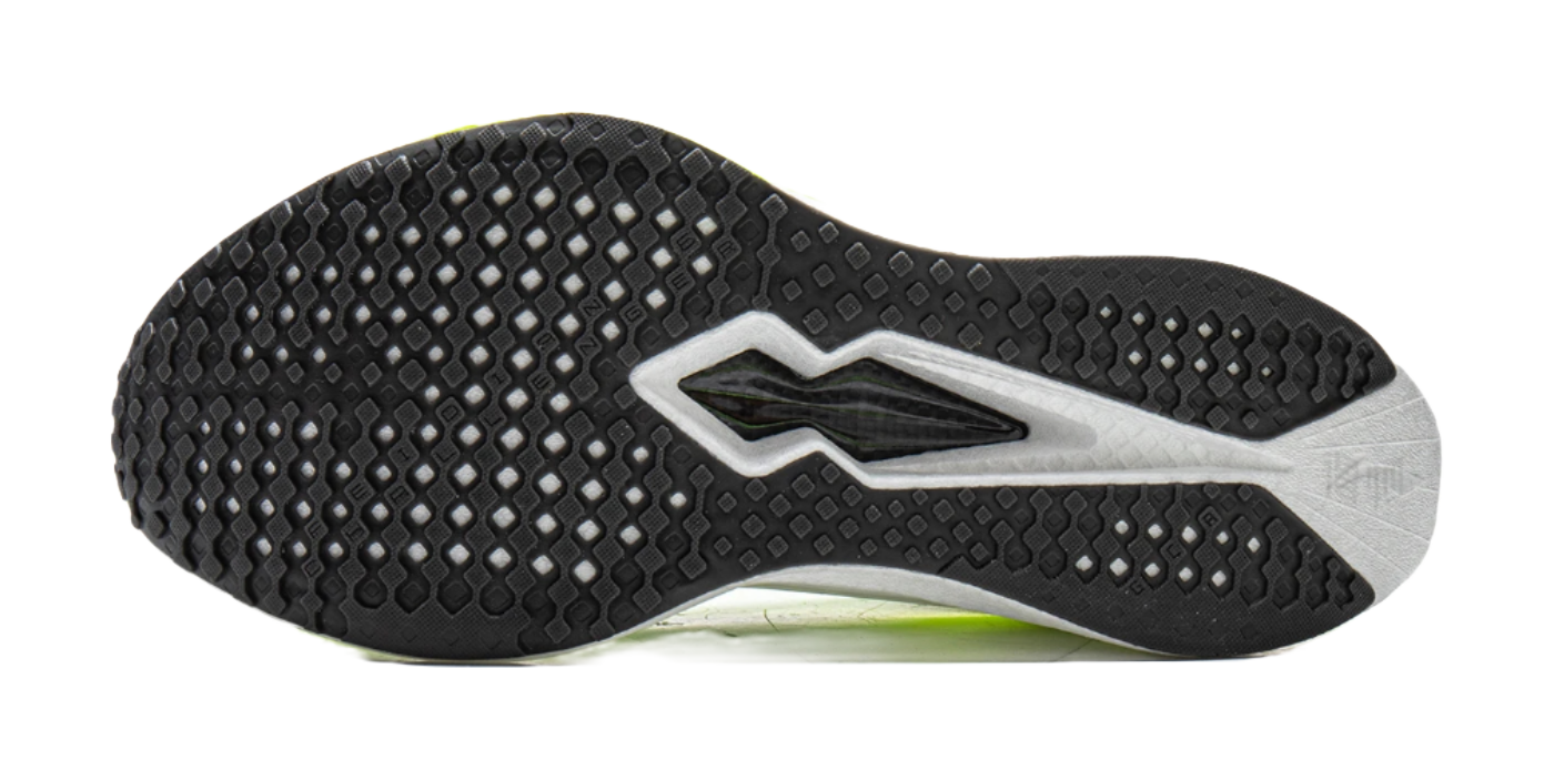 Black rubber tread outsole with gray edges and fluorescent green midfoot accent