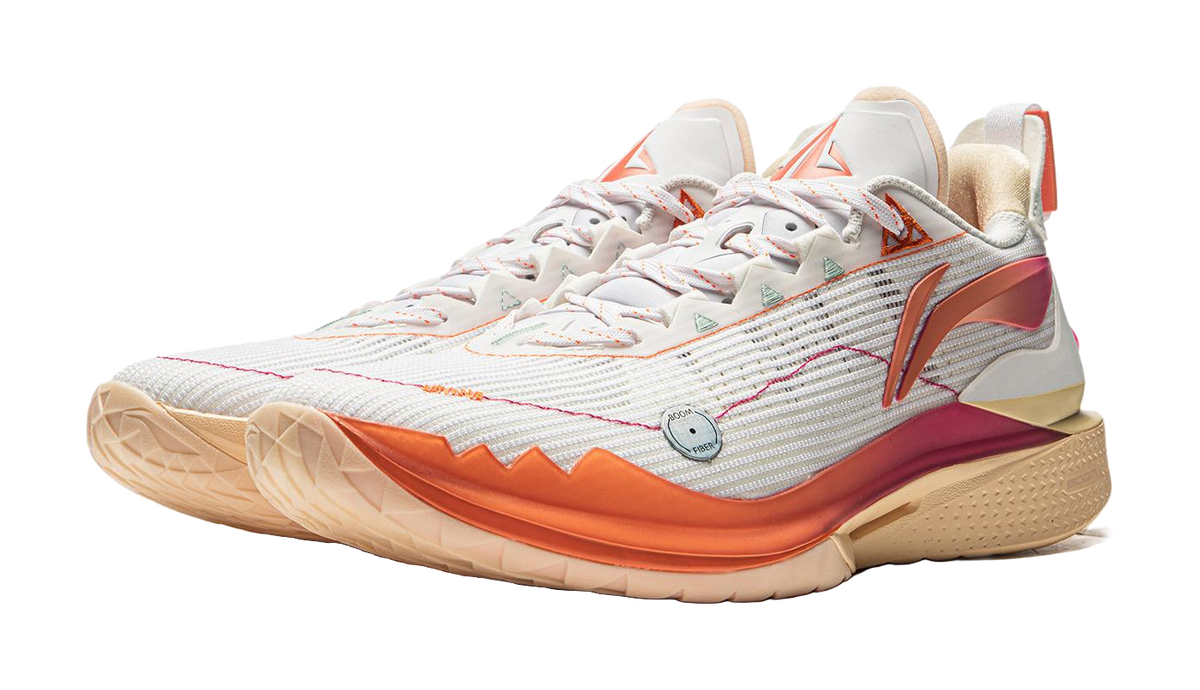 White basketball shoe with orange side stripe and magenta heel accents