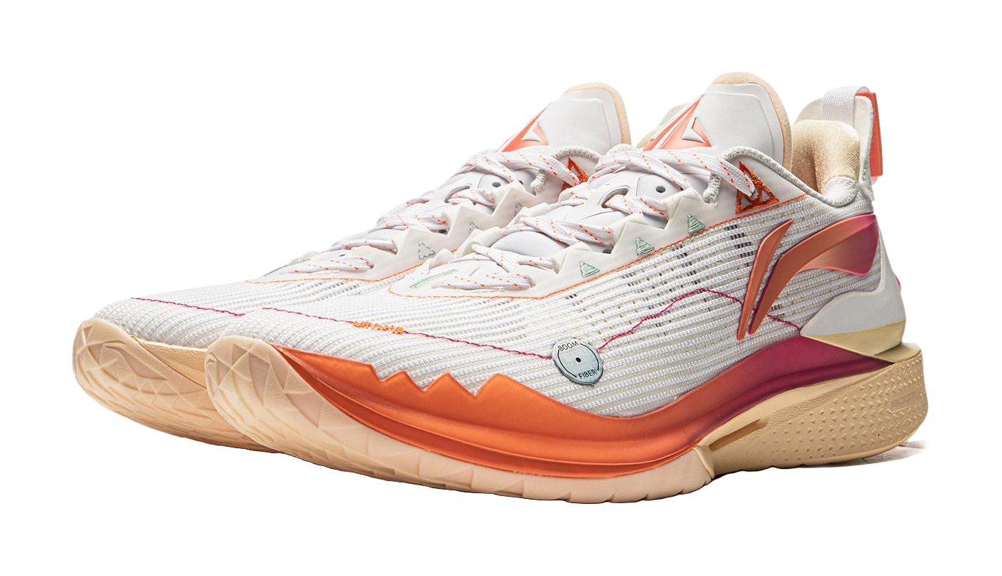 White basketball shoe with orange side stripe and magenta heel accents