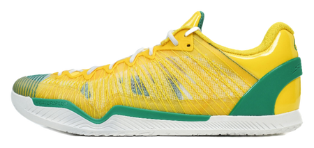Yellow basketball shoe with green side panel, white laces, and textured sole