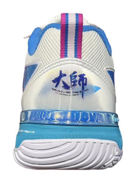 White badminton shoe heel with blue and pink striped collar, teal midsole