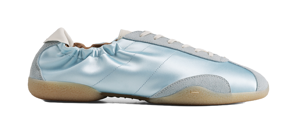 Light blue lace-up low-top casual shoes with suede side panels and tan rubber sole.