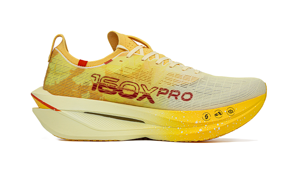 Men's racing shoe, yellow knit upper with red branding, white foam midsole.