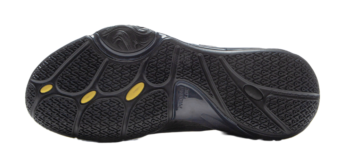 Black basketball shoe outsole with textured traction pattern and gold oval marks