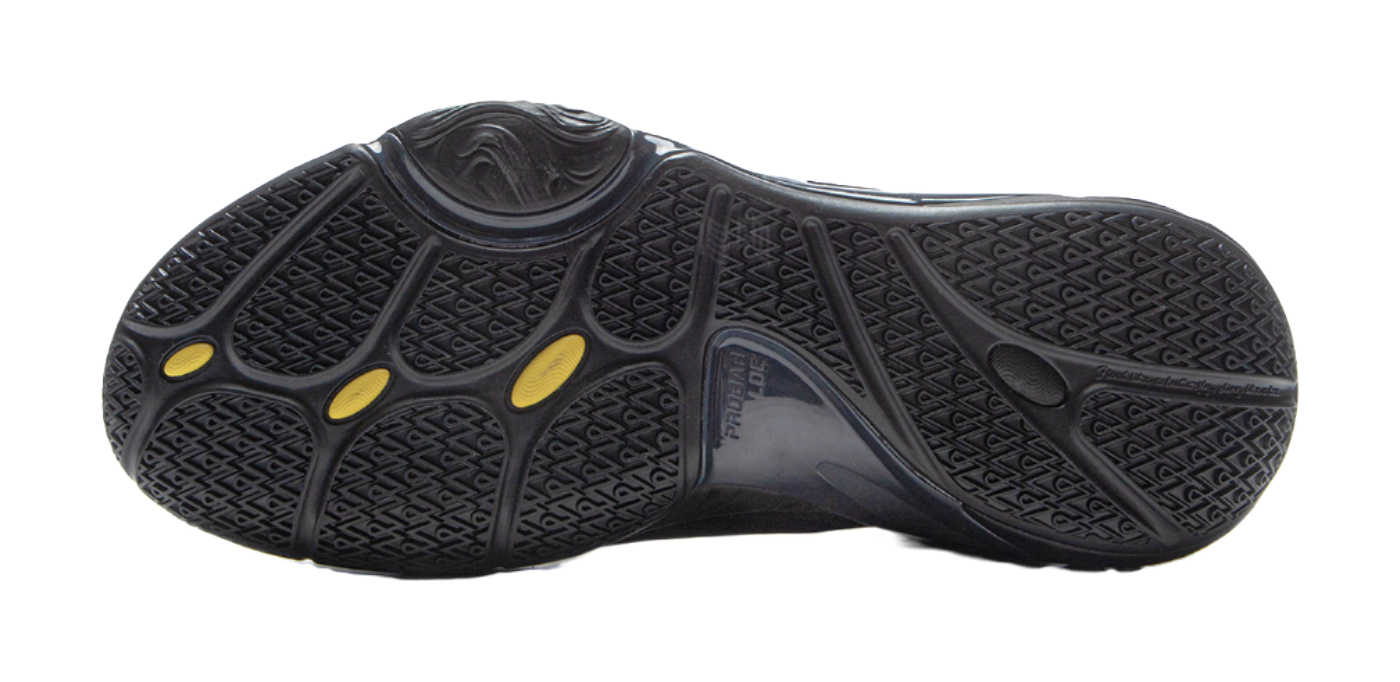 Black basketball shoe outsole with textured traction pattern and gold oval marks