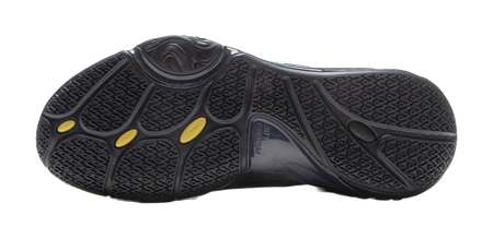 Black basketball shoe outsole with textured traction pattern and gold oval marks