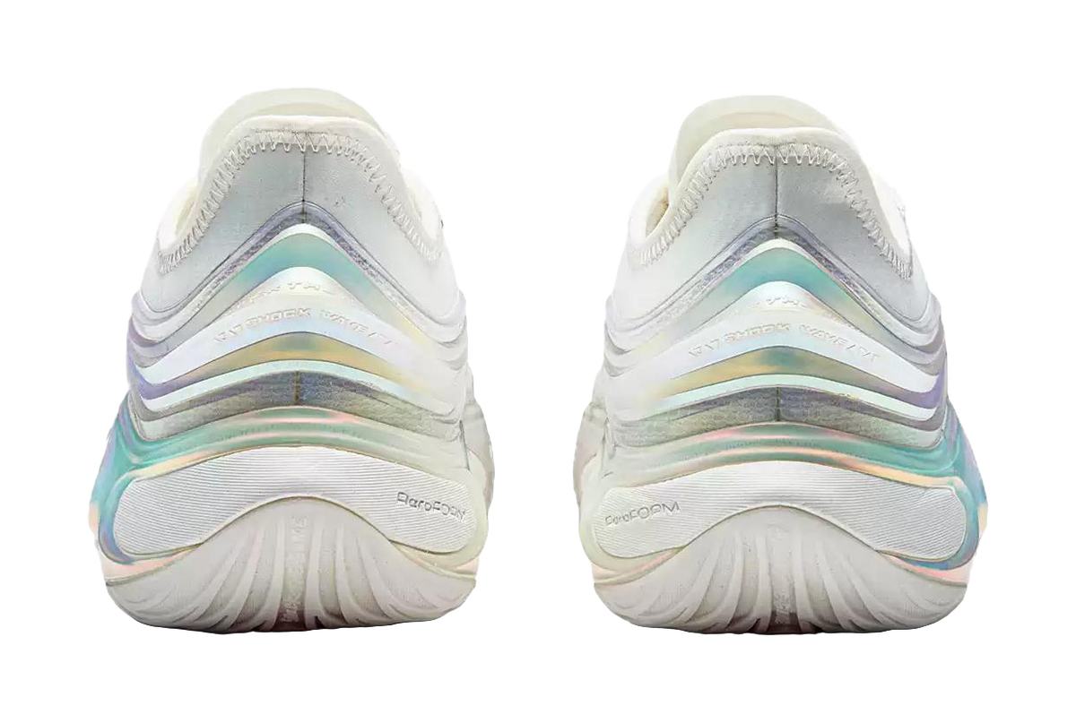 Back view of white basketball shoes with iridescent stripes on midsole and cushioned heel