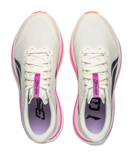 Pair of women's low-top running shoes with white laces, purple tongue labels, pink trim