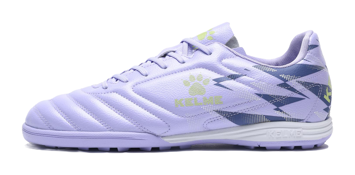 Lilac purple unisex TF turf soccer shoes with lace-up design and side graphic