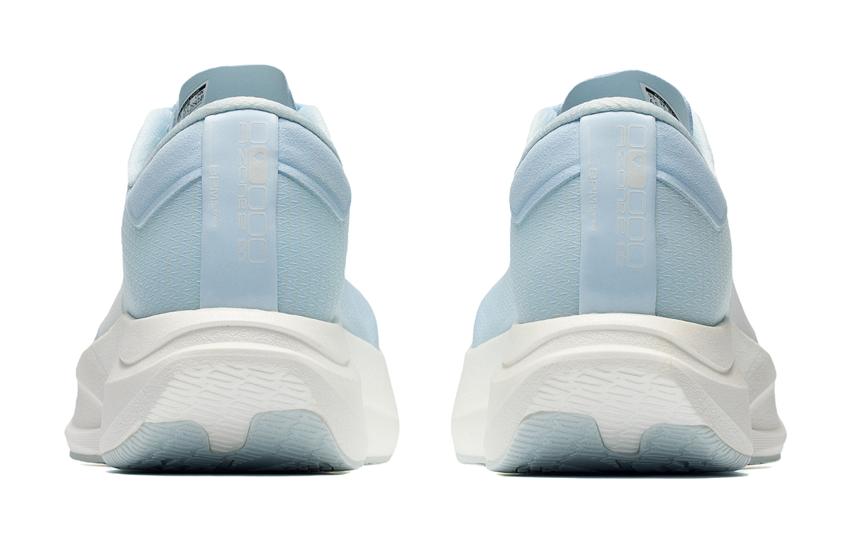 Light blue low-top running shoes, rear view with cushioned heel and molded midsole