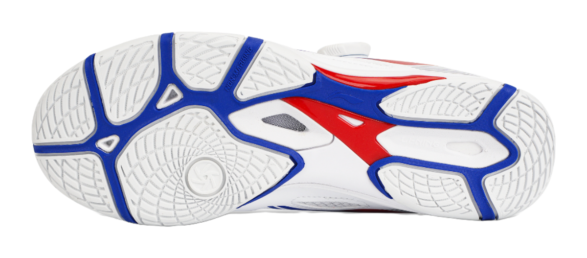 Table tennis shoe outsole with white traction pattern and blue/red side striping