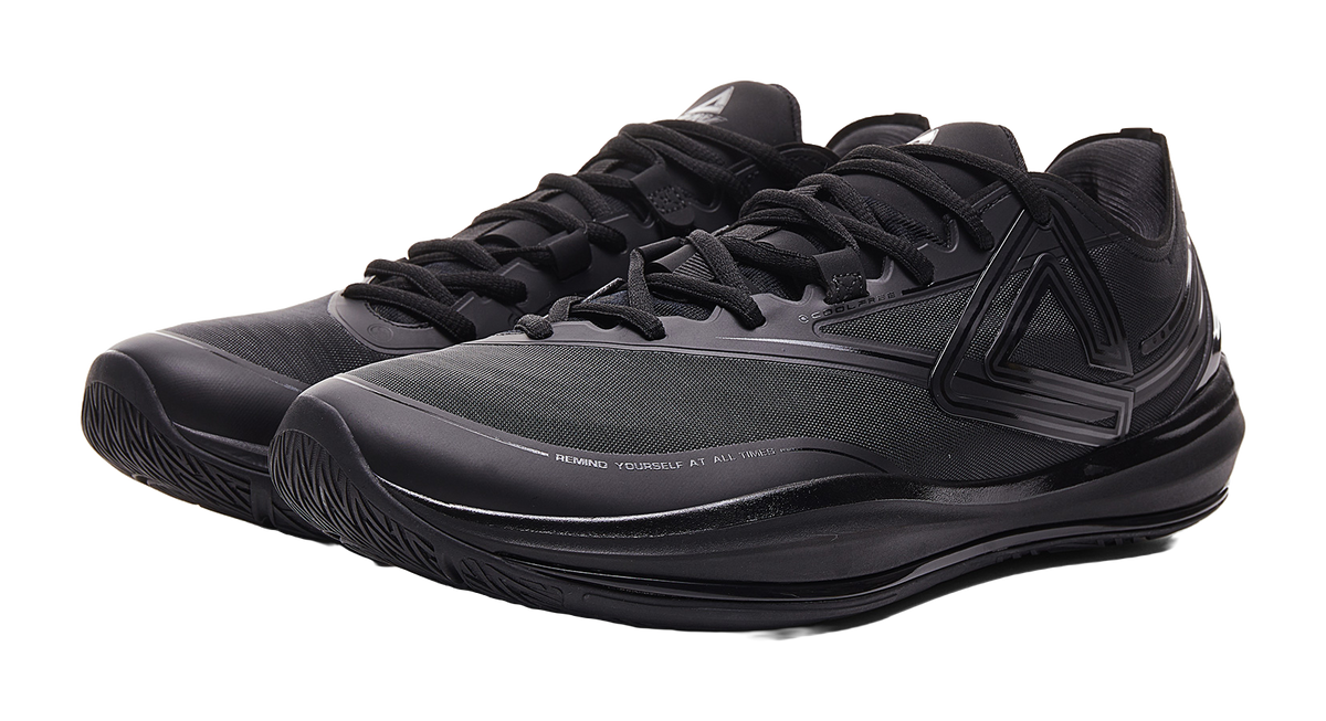 Black basketball shoe with lace-up vamp and sculpted side guard detailing.
