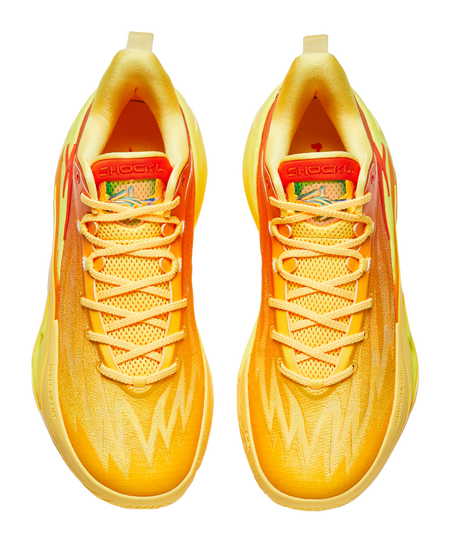 Pair of yellow and orange basketball shoes with mesh laces and padded tongue with logo.