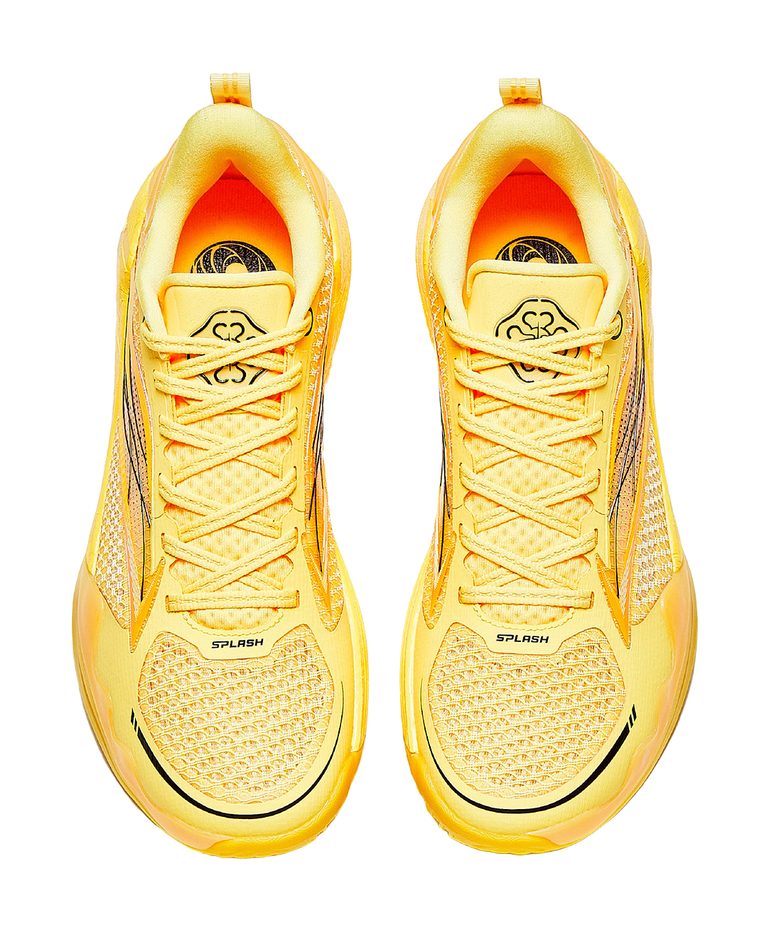 Pair of yellow lace-up basketball shoes with mesh-like texture and cushioned tongue