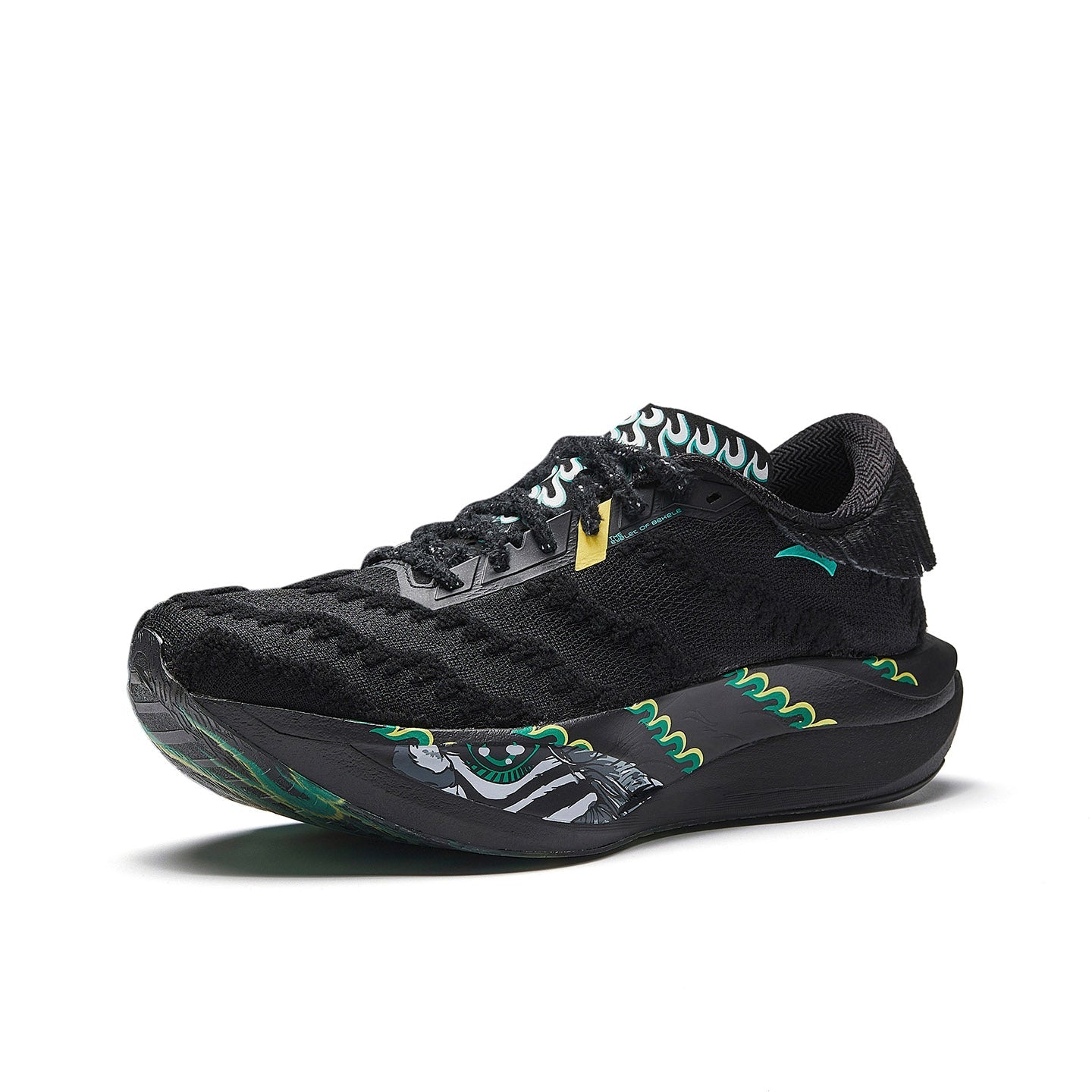 Women’s black lace-up running shoe with green accents and flame-pattern midsole.