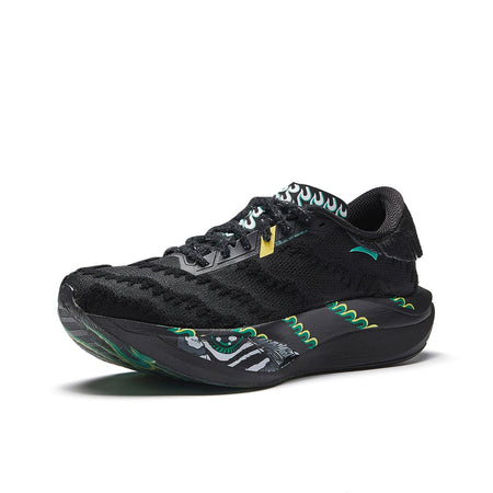 Women’s black lace-up running shoe with green accents and flame-pattern midsole.