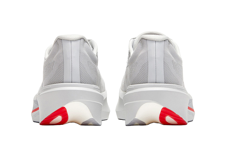 Back view of gray low running shoes, heel tabs, red stripe on outsole