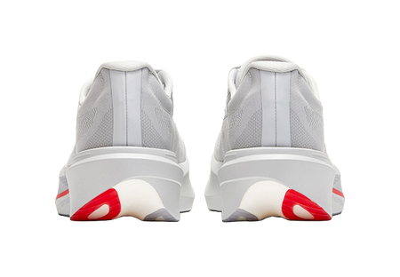 Back view of gray low running shoes, heel tabs, red stripe on outsole