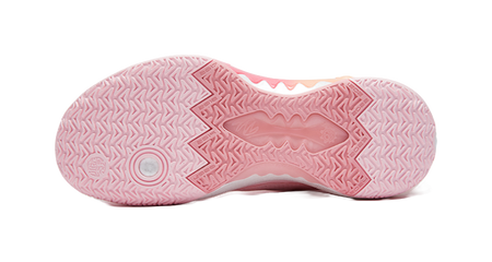 Pink outsole with geometric traction pattern on underside of basketball shoe