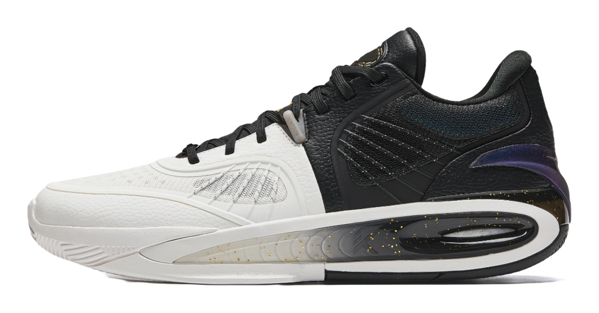 White and black basketball shoe with low-top lace-up design and translucent outsole