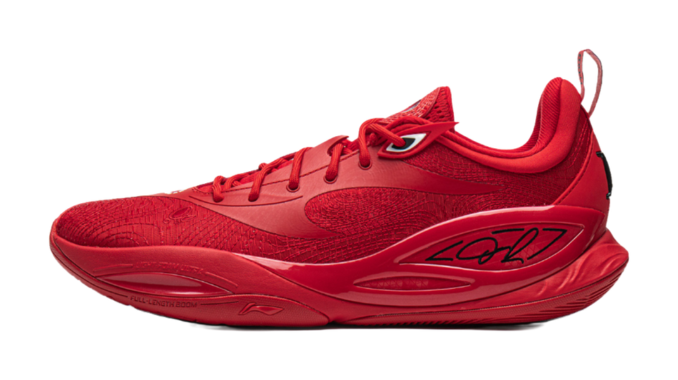 Red basketball shoe with lace-up closure and textured upper, white logo accents.
