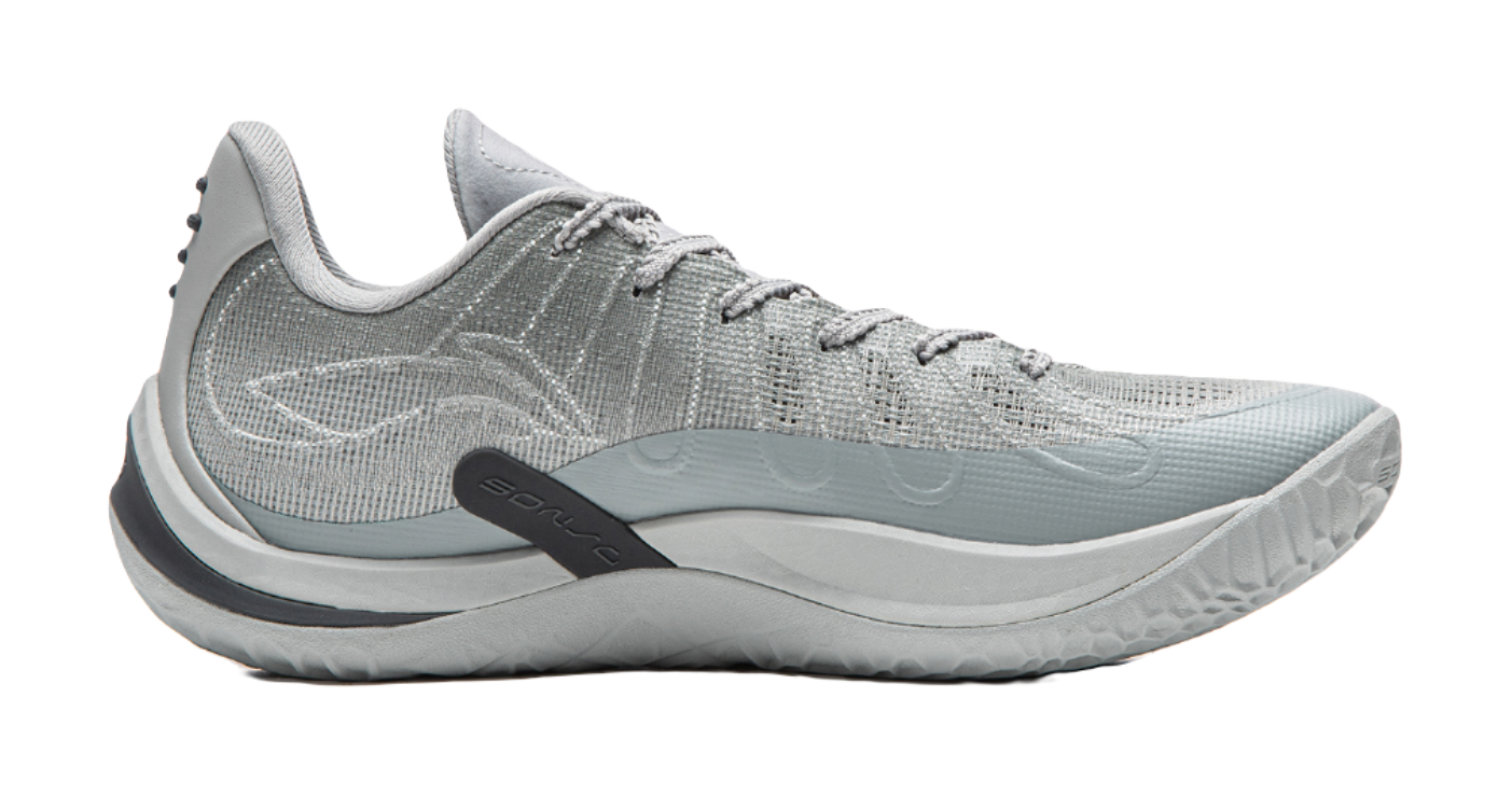 Gray basketball shoe side view with teal accent midsole