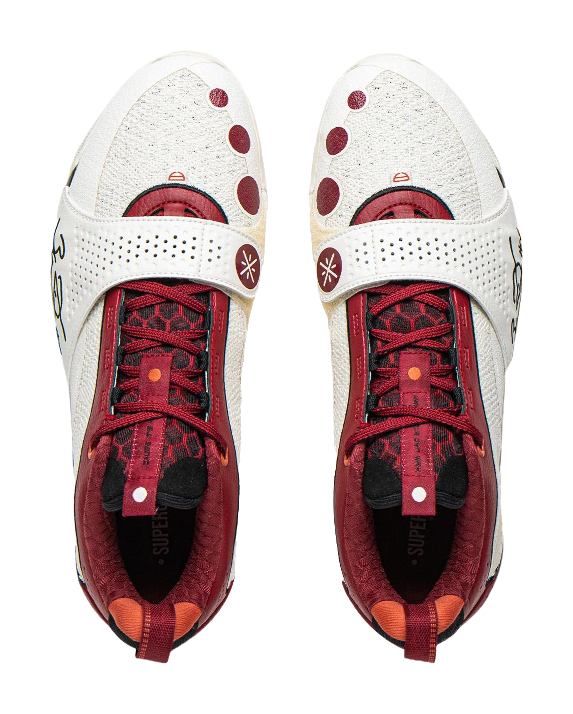 Pair of white basketball shoes with red laces, red patterned lining, and cushioned tongues