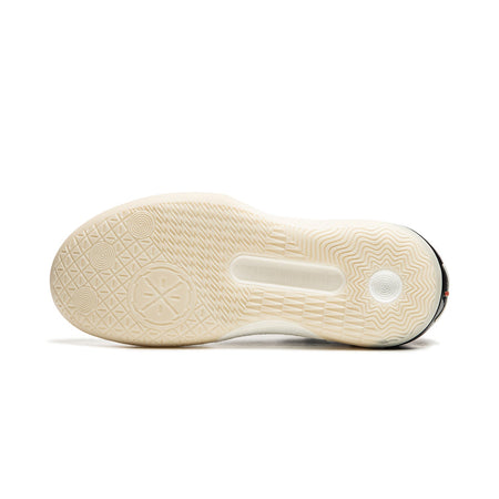 Beige rubber basketball shoe outsole with traction pattern and center cutout.