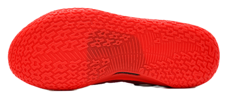 Red basketball shoe outsole with multidirectional traction pattern