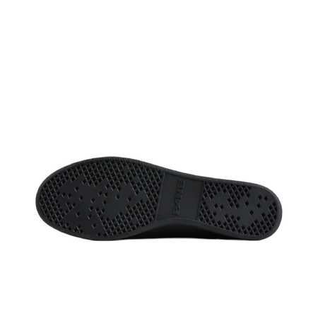 Black rubber outsole with textured diamond tread pattern on low-top training shoe.