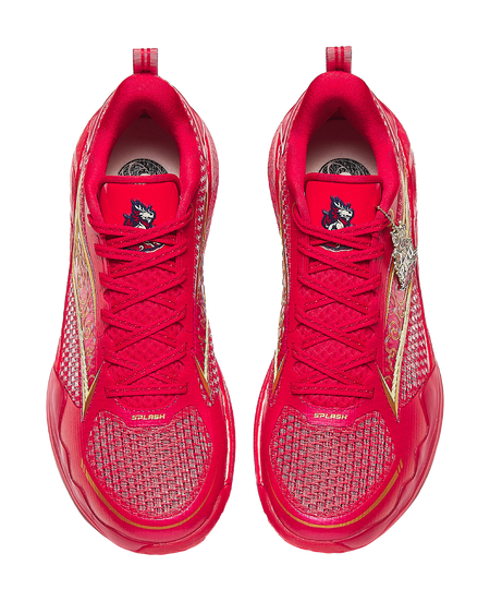 Pair of red basketball shoes with red laces, textured uppers, and gold side panels.