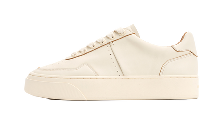 Antique white low-top skate shoes with lace-up closure and stitched paneling