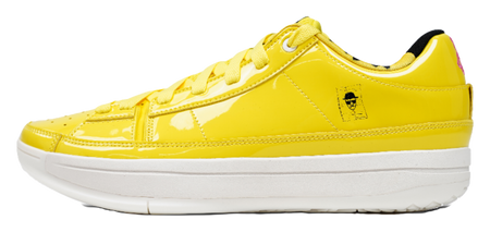 Yellow low-top basketball shoes with lace-up front and white rubber sole