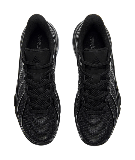 Pair of black low-top basketball shoes with lace-up vamps and padded collar