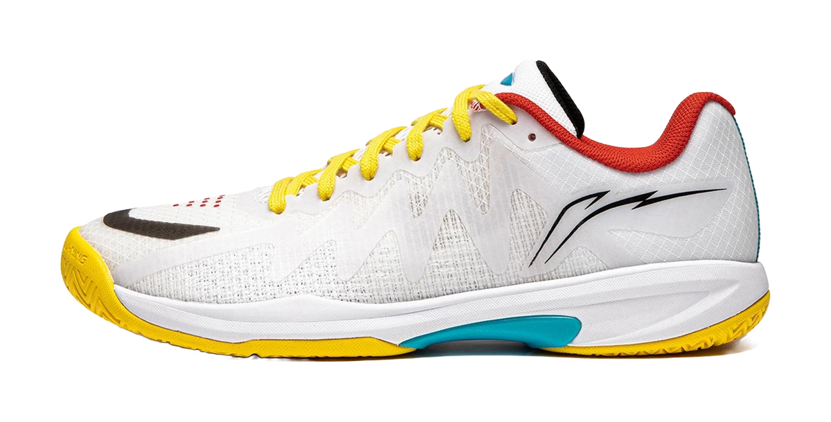 White table tennis shoe with yellow laces and yellow outsole, red and teal accents
