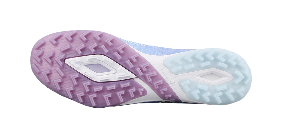 Turf soccer shoe outsole with blue and purple rubber studs traction pattern