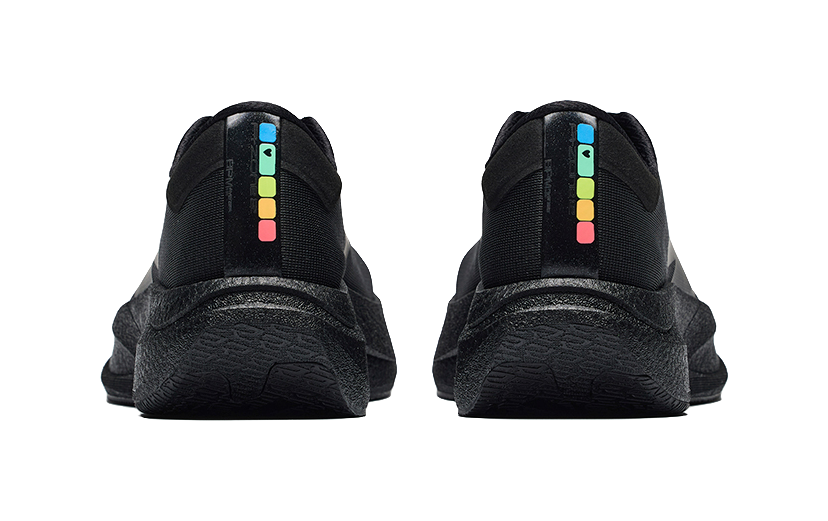 Pair of men's black running shoes, rear view with cushioned heel and colorful logo strip
