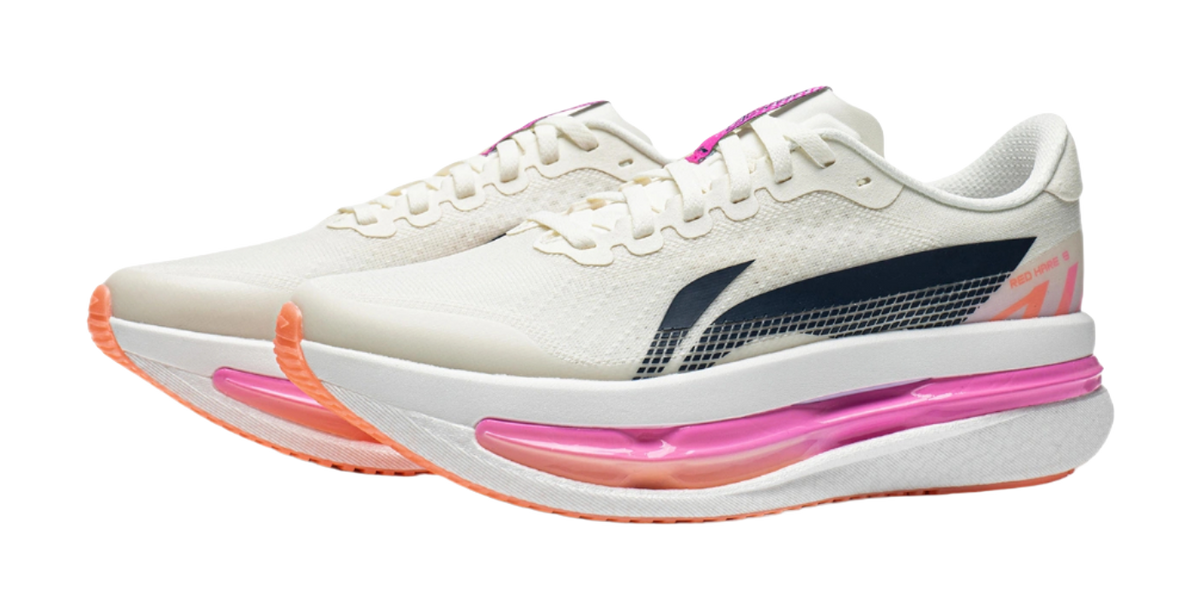 Women's low-top running shoes, champagne white with navy panel, pink midsole, orange outsole