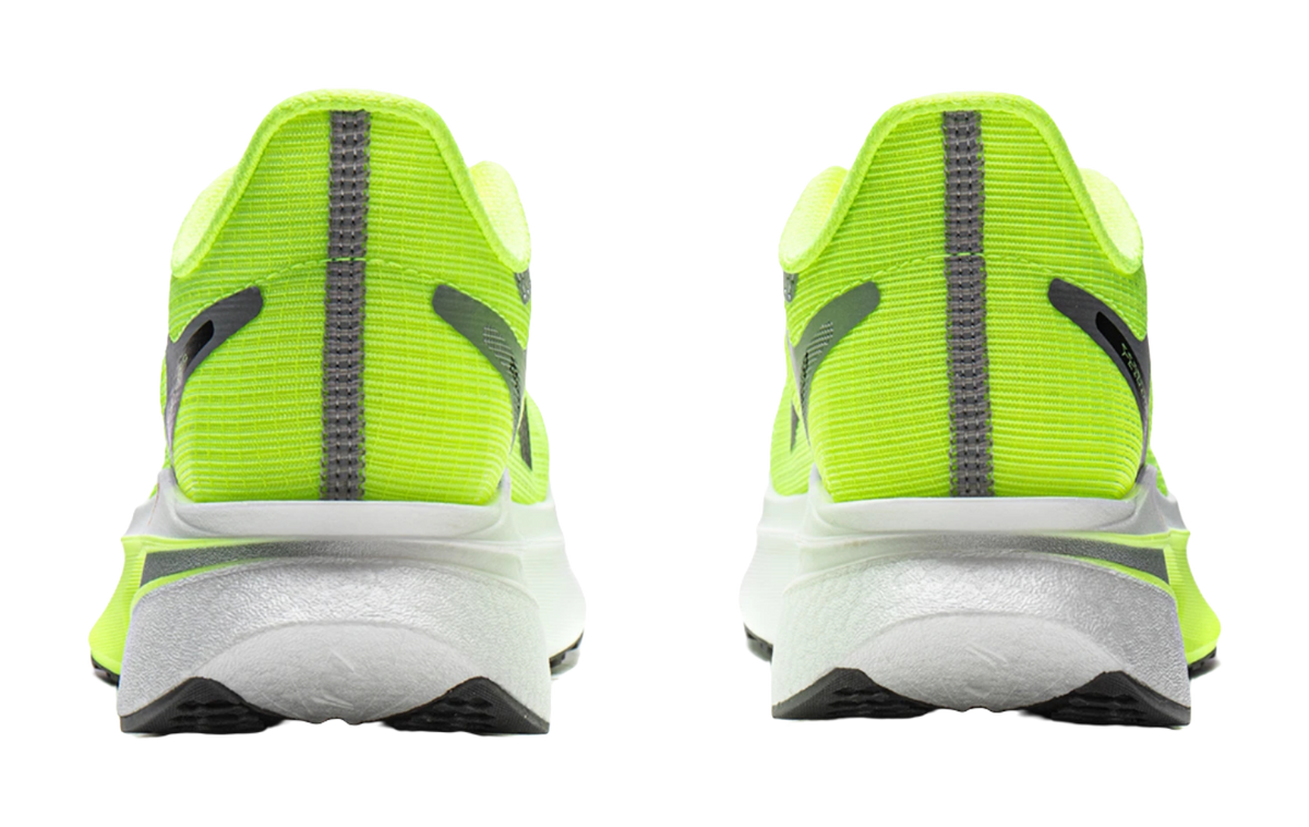 Neon green running shoes with gray heel counter and black vertical stripe