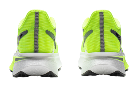 Neon green running shoes with gray heel counter and black vertical stripe