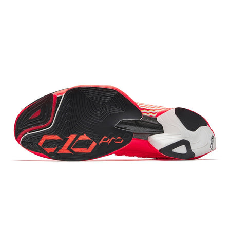 Neon red running shoes outsole view with black traction pattern and red accents
