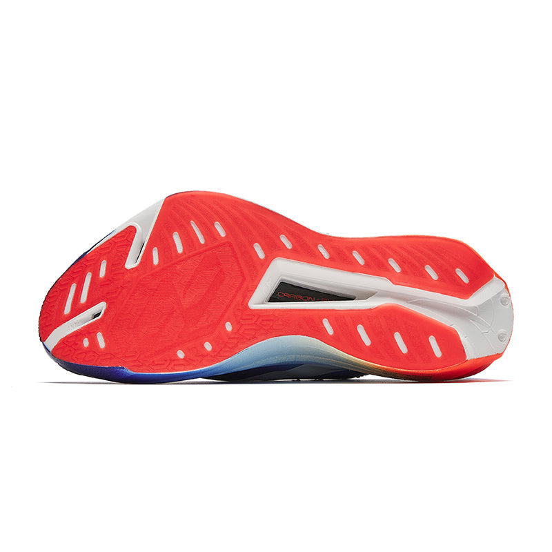 Marathon racing shoe outsole, red patterned tread with white inserts, blue midsole edge.